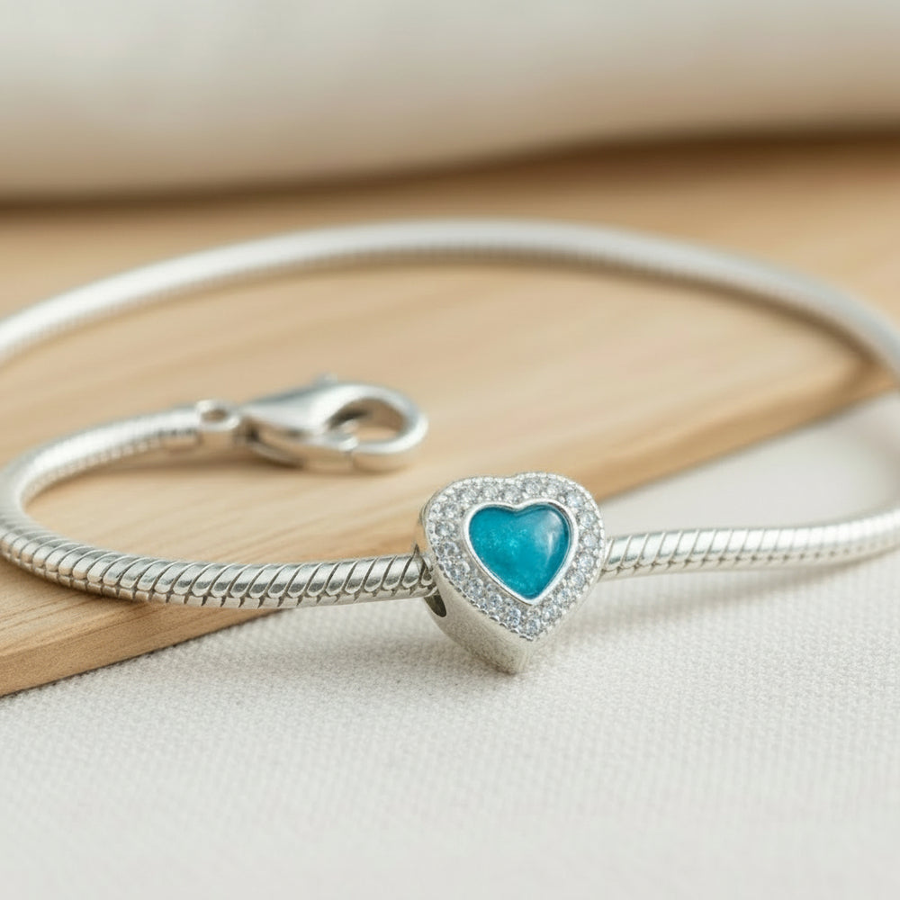 Crystal Heart Ashes Charm Bead on a charm bracelet - Nicky Robin Memorial Jewellery