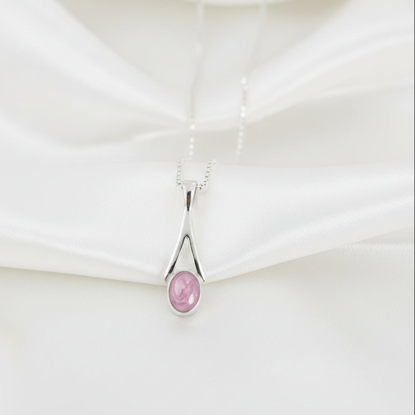 Dainty Oval Drop Memorial Ashes Necklace draped over satin - Nicky Robin Memorial Jewellery