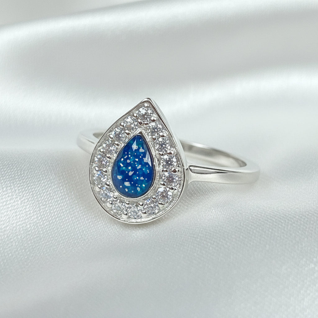 Memorial Ashes Teardrop Halo Cubic Zirconia Ring made in custom blue with ashes
