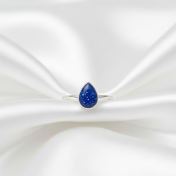 teardrop memorial ashes stacker ring on white satin display