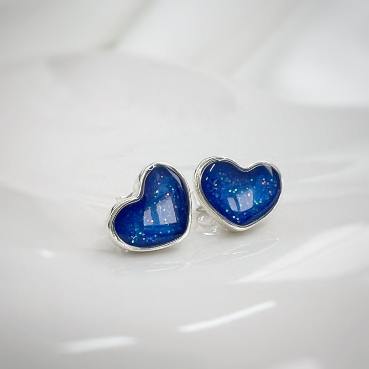 true-heart-memorial-ashes-earrings-made with ashes hidden under sapphire blue resin