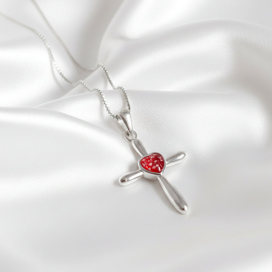 Heart cross ashes necklace made in red resin placed on satin